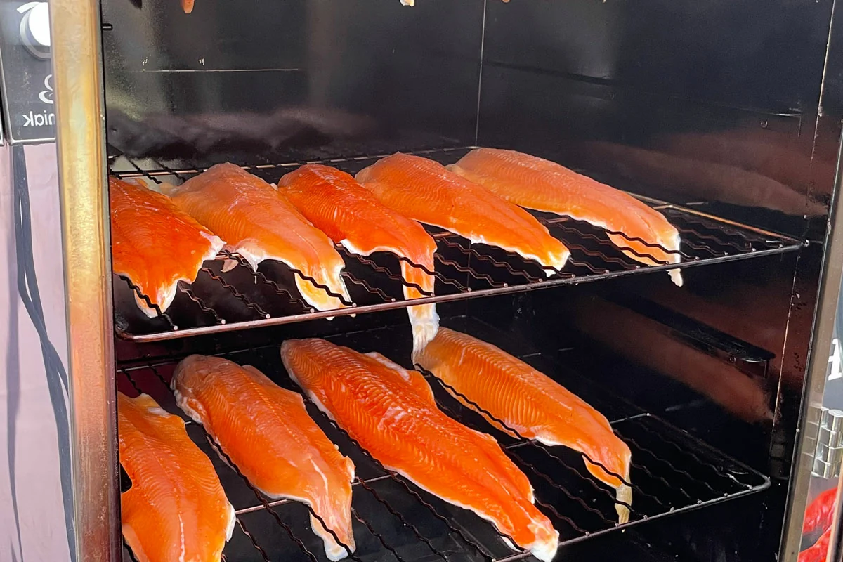 Salmon fillets on racks inside a Borniak smoker