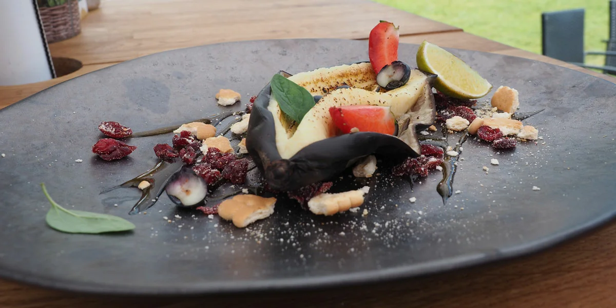 A smoked banana dessert served on a plate